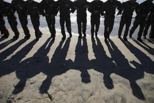 U.S. Navy SEAL candidates participate in BUD/S training.