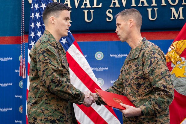 A Marine Corps captain is awarded the Navy and Marine Corps Medal.