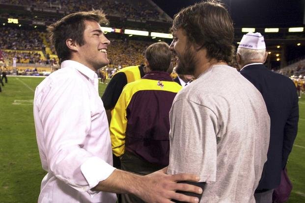 Richard Tillman, left, the brother of former Arizona State player Pat Tillman, greets one of his brother