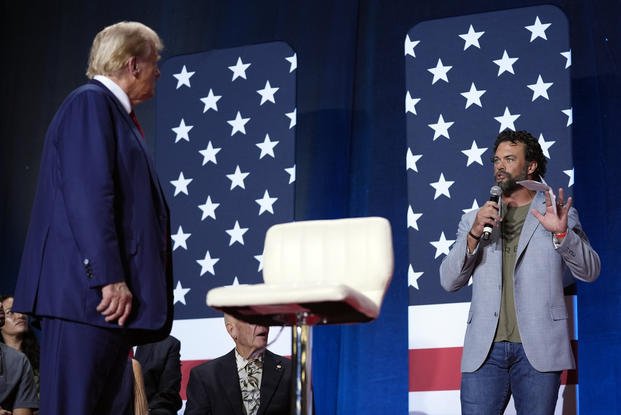 Donald Trump listens as Matthew Lohmeier asks a question
