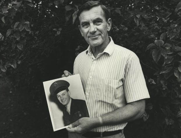 Ken Budd holds a photo of brother, Robert in 1989. The photo was taken shortly before Ken