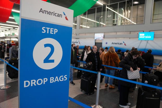 Holiday travelers gather at O