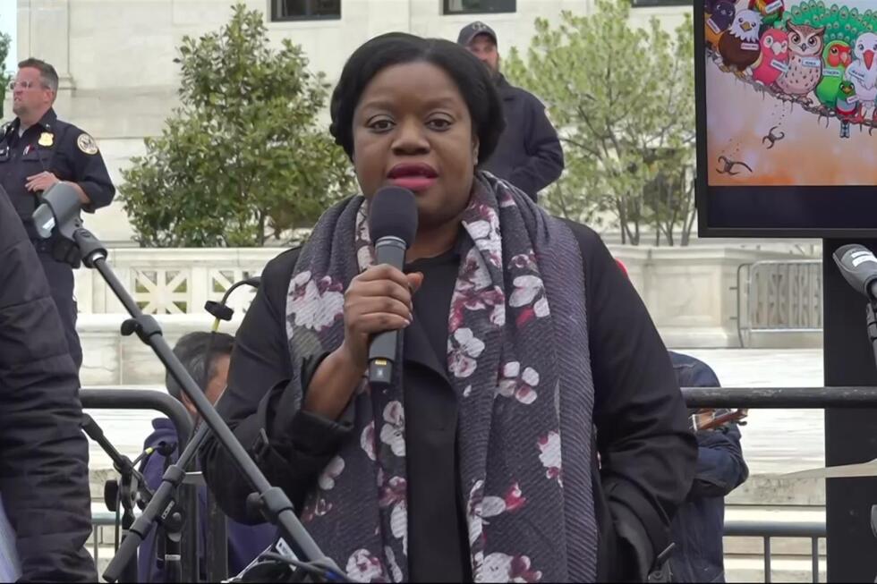 Immigrants rally outside Supreme Court arguments on bid to end protections for Haitians, Syrians