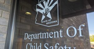 Hobbs signs slate of bills to improve child safety, reform DCS