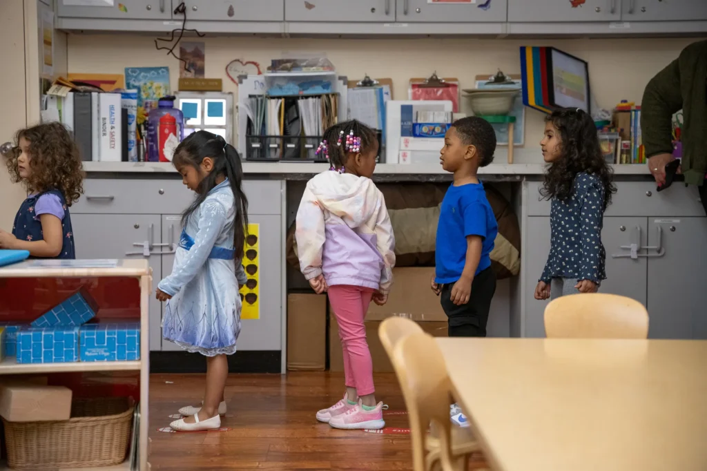 Preschool children line up to go outside at the Ralph Hawley Head Start Center in Emeryville, Calif., in December. The Trump administration has proposed major changes to the Head Start program. (Photo by Florence Middleton for CalMatters)