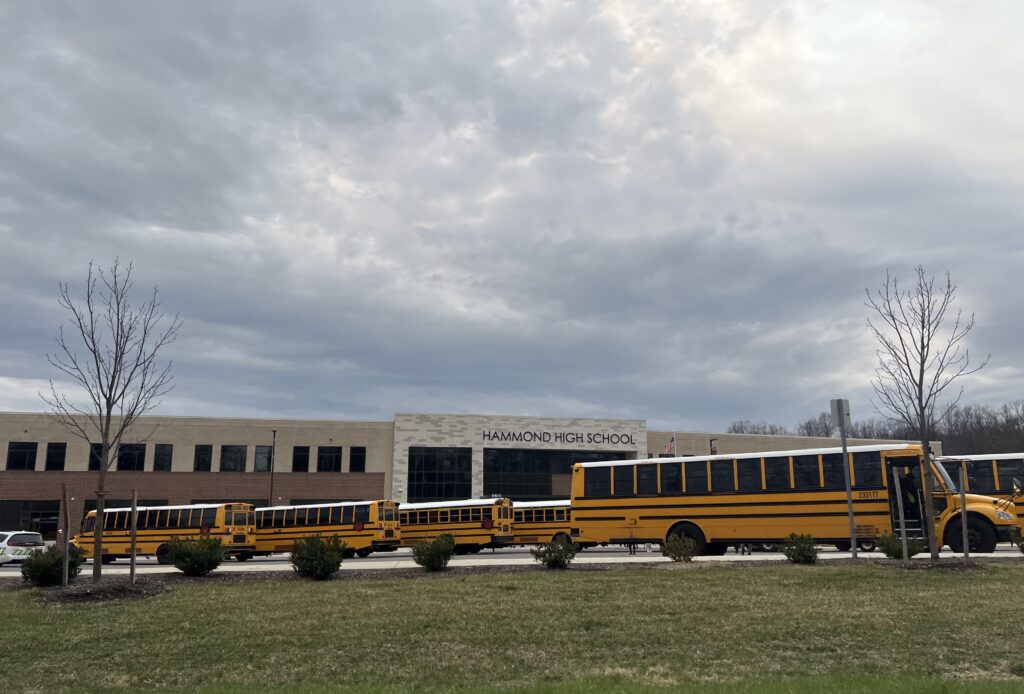 School buses parked outside Hammond High School in Columbia, Md., a suburb of Baltimore. Students ages 12 to 18 experienced higher rates of reported victimization at school than away from school in 2024, according to a new report from the federal Bureau of Justice Statistics. (Photo by Amanda Watford/Stateline)
