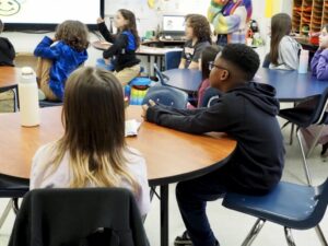 Fourth graders sit at their classroom tables in Oklahoma City. A new government watchdog report raises concerns about oversight of education spending and absenteeism data. (Photo by Nuria Martinez-Keel/Oklahoma Voice)