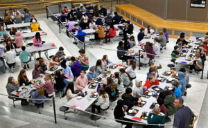 Students eat lunch at Carl Ben Eielson Middle School in Fargo on Jan. 22, 2025. School districts statewide reported student meal debt of about $2 million at the end of the 2025-26 school year, according to the Department of Public Instruction. (Photo by Dan Koeck/For the North Dakota Monitor)