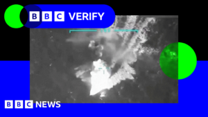An image taken from footage shared of the strike by Donald Trump. A boat can be seen moving in the ocean from what appears to be a drone camera.